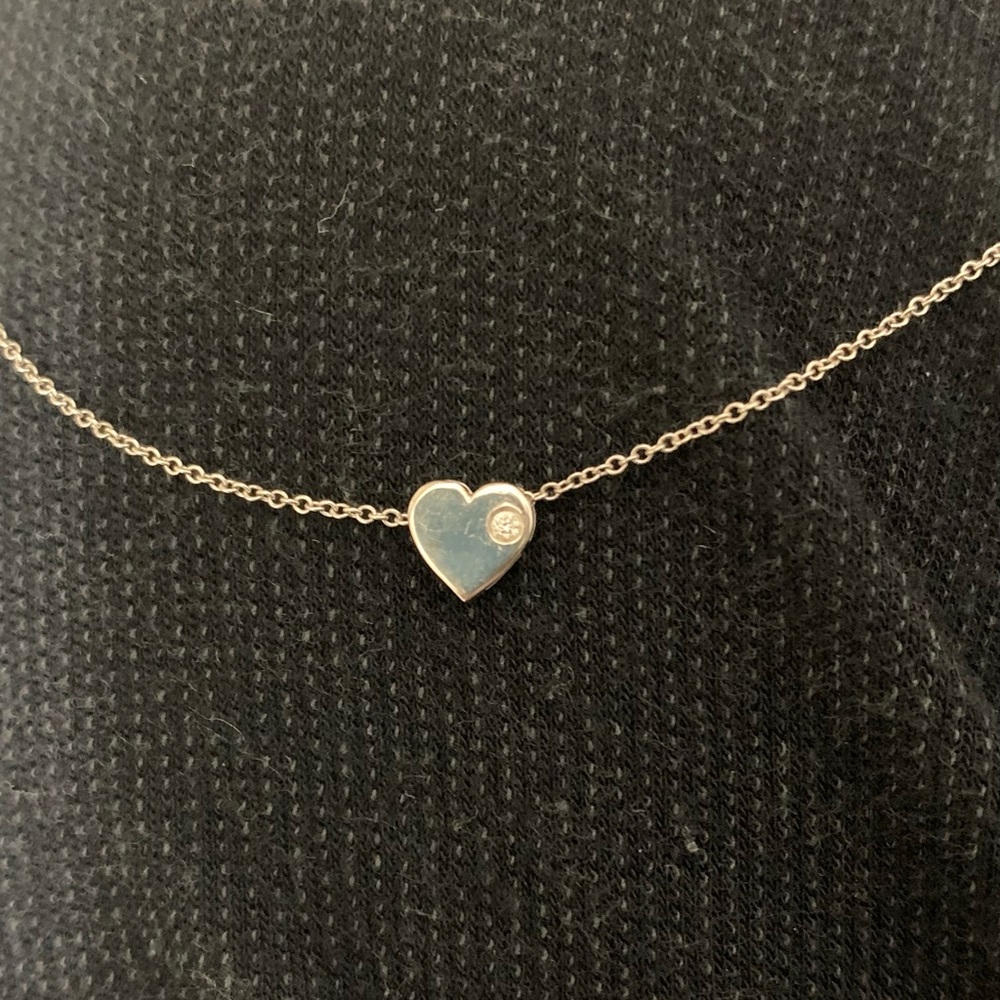 White gold necklace.Heart charm with real diamond.15 inch adjustable chain